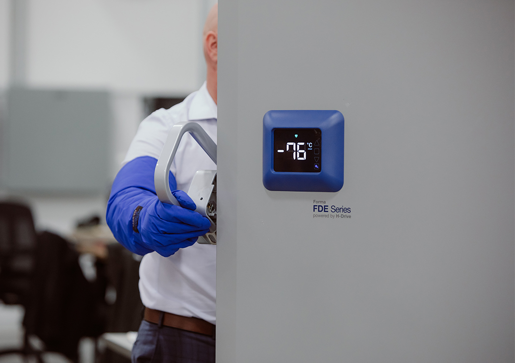 Worker Opening the Door To The Cold Storage Unit