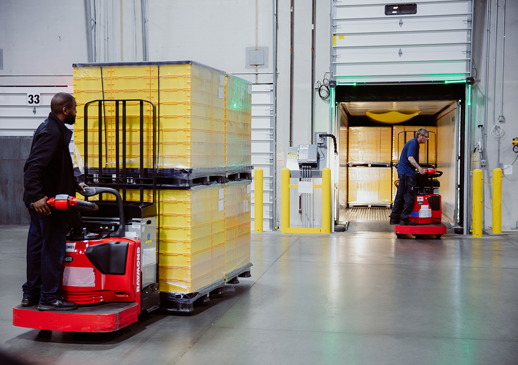 Workers in Forklift Handling Pharmaceutical & Medical Supplies Inside MMI Warehouse