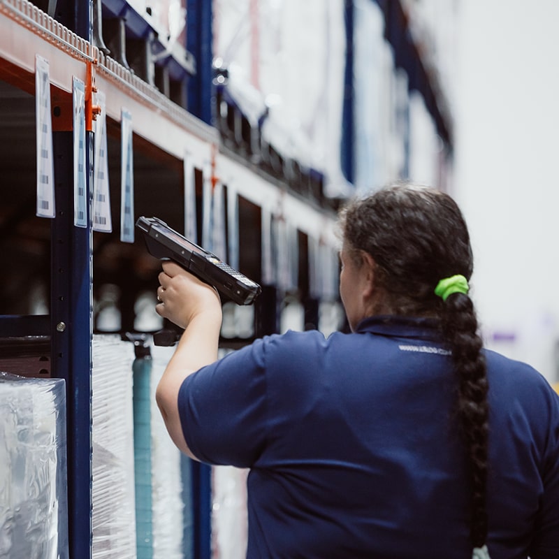Female MMI Worker Handling Inventory Management