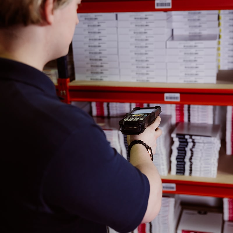 Worker in Warehouse Providing Picking, Packing, and Shipping Services